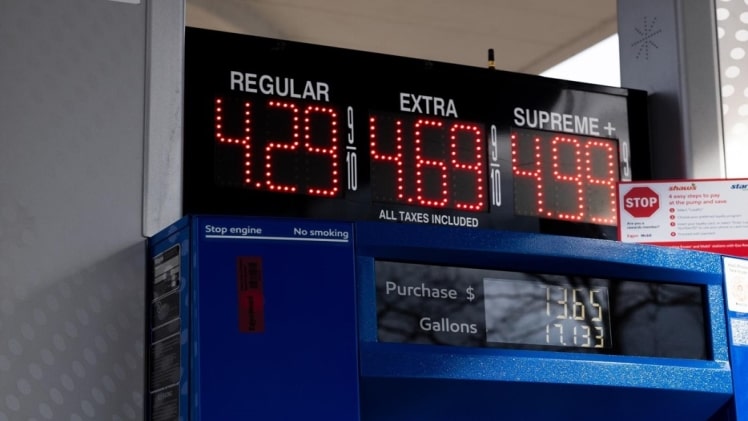 A picture of a gas pump showing the high gas prices and money you can save with an electric vehicle.